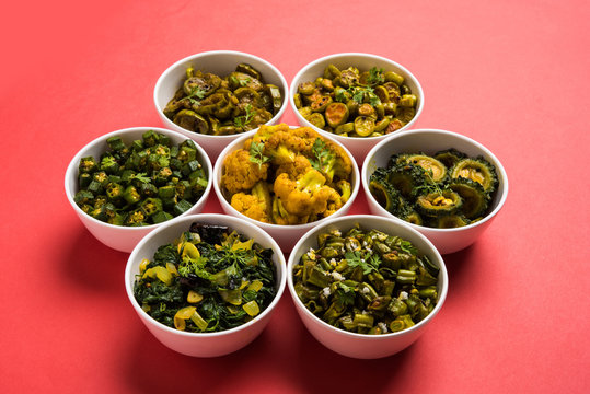 Indian sabzi / vegetable fried recipes served in white bowl over moody or colourful background. selective focus
