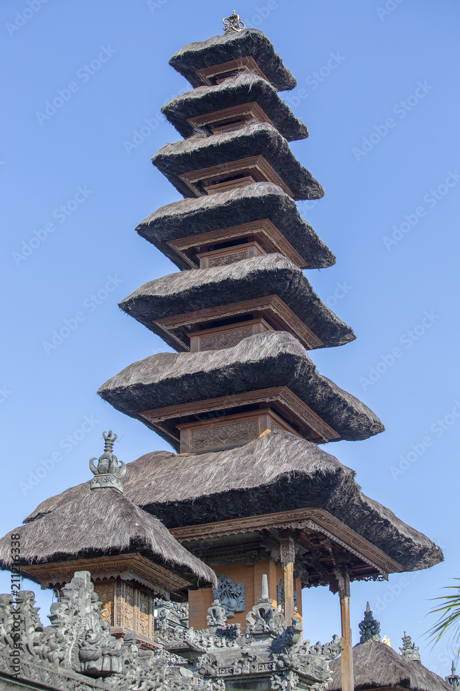 Wall mural Traditional balinese roofs in hindu temple of Bali Island, Indonesia. Travel and architecture background