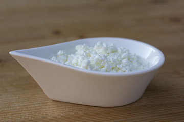 healthy curd. dairy product. domestic production of curd. curd in a white bowl