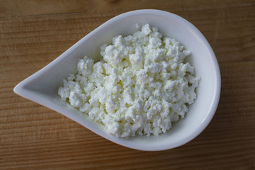 healthy curd. dairy product. domestic production of curd. curd in a white bowl