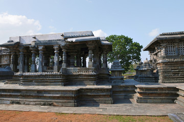Fototapeta na wymiar Nandi Mandapa on the left and Shantaleswara shrine on the right, Hoysaleshvara Temple, Halebid, Karnataka. View from North.