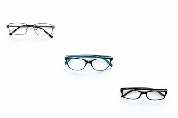 Glasses concept. Set of glasses with different eyeglass frame and transparent lenses on white...