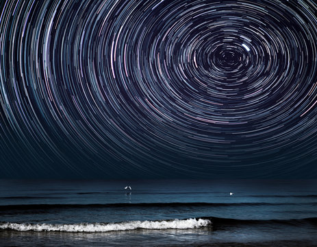 a star trail photography with Polaris over a sea