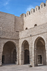 Naklejka premium The inner courtyard of the fortress Ribat in Sousse /Tunisia, Sousse. The old city (Medina), the fortress-monastery Ribat, built in the eighth century AD. The inner courtyard of the fortress.