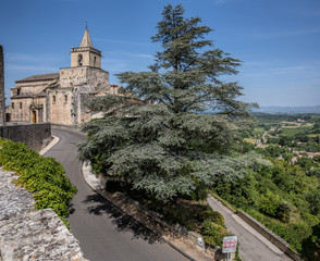 Naklejka premium Church and road in the town of Venasque, Provence, France