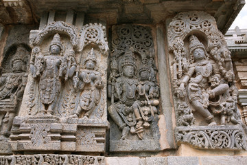 Ornate bas relieif and sculptures of Hindu deities, Kedareshwara Temple, Halebid, Karnataka