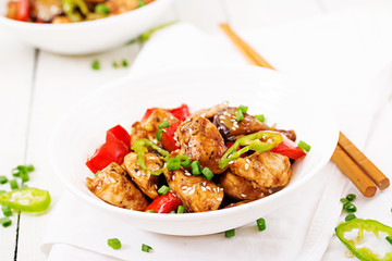 Homemade kung pao chicken with peppers and vegetables. Chinese food. Stir fry.