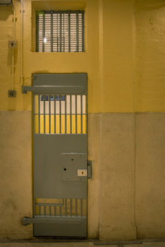 vintage iron jail door in prison building with copy space in cinematic tone