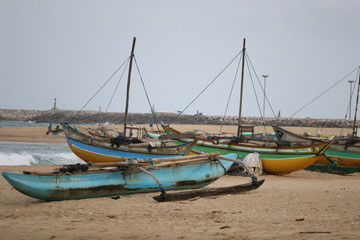 Naklejka na ściany i meble fishers boat near beach