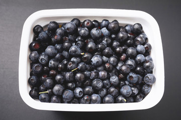 forest berry blueberry on a black background.