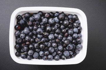 forest berry blueberry on a black background.