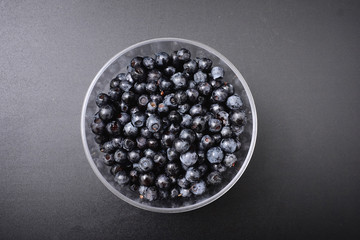 forest berry blueberry on a black background.