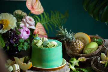 Fototapeta na wymiar Exotic fruit cake among plants