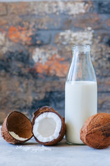 Coconut milk, whole coconuts on a white background. Coconut products concept.