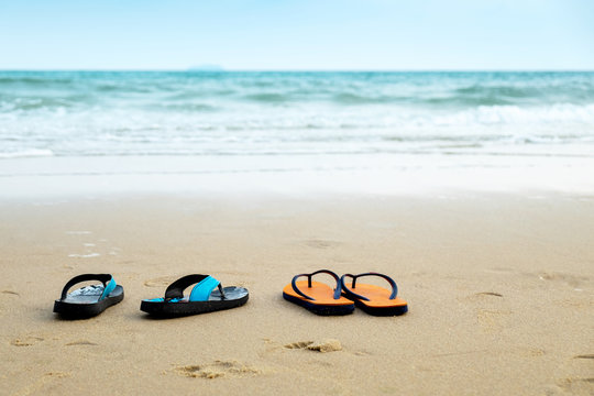 Two Pairs of Lover Sandal on the Beach, Romantic Scence in the Vacation Beach Trip Travel.