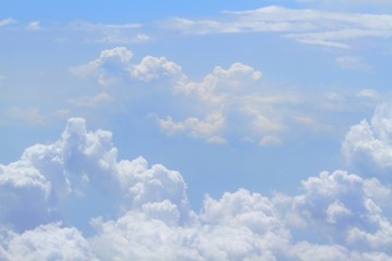 Skyline view from airplane, nice blue sky / Sky with curly nice clouds in daytime
