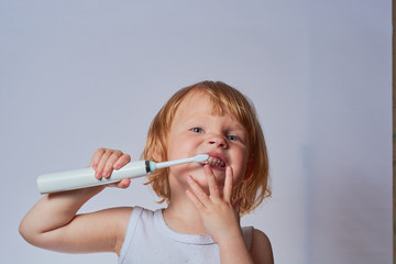 baby brushing her teeth