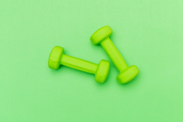 dumbbells on a color background