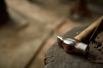 Working metal tools in blacksmith's workshop, close-up, selective focus, nobody