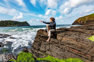 Woman enjoys the lively Atlantic Ocean