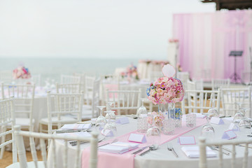 Wedding table setup at Beach Wedding Ceremony on the beach with sea and sky