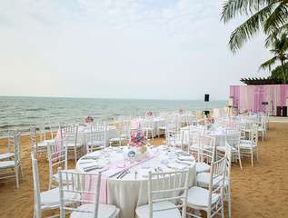 Wedding table setup at Beach Wedding Ceremony on the beach with sea and sky