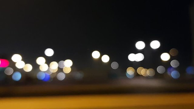 Blurred lights. Bokeh of the street. A man's greatest late night walk or run partner. The blurred passing cars make the footage more immersive as ever.