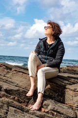 Woman enjoys the lively Atlantic Ocean