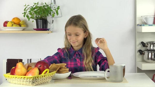 Child Drinking Milk at Breakfast, Kid Eating Bread and Chocolate, Girl in Kitchen