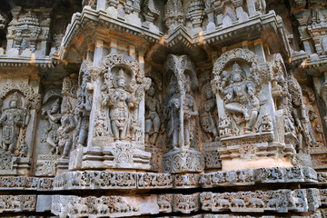 Ornate bas relieif and sculptures of Hindu deities, Kedareshwara Temple, Halebid, Karnataka