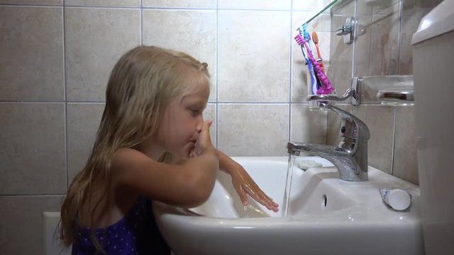 Child Washing Hands, Face, Kid Portrait in Bathroom, Girl Healthy Hygiene    