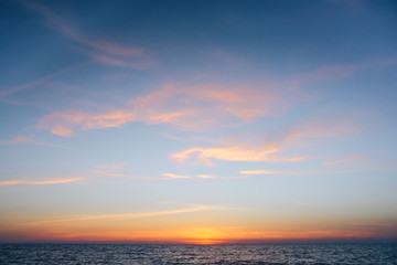 Sunrise / sunset on the ocean horizon.