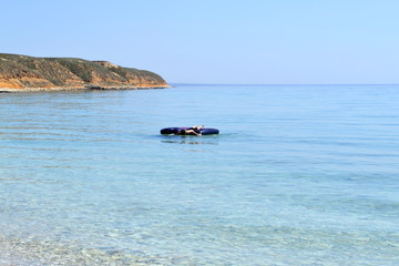 Airbed in the water amidst the mountains.