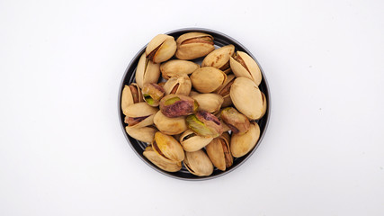 Pistachios on white background.It's green nut .