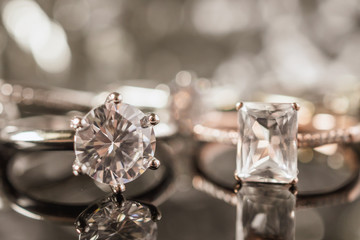 Luxury Jewelry diamond rings with reflection on black background