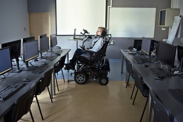 Disabled student in class room.