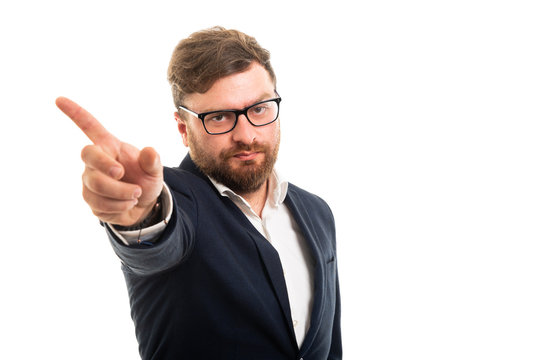 Portrait of business man showing get out gesture.