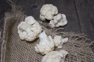 Fresh organic cauliflower in a bowl on wooden background