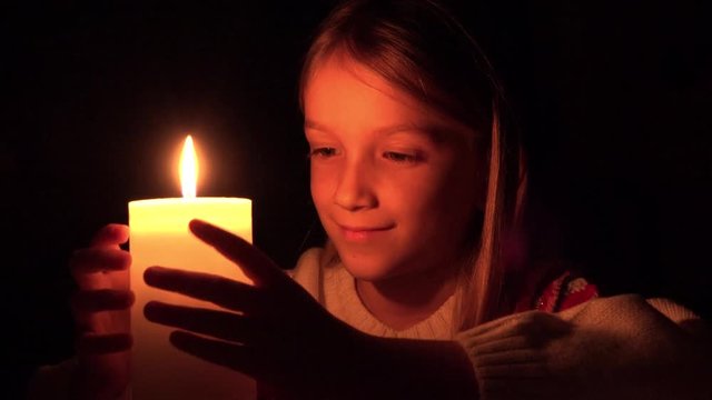 Happy Child by Candle, Smiling Prayer Kid in Night, Girl Portrait, Dark Face