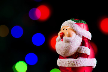 Cute Santa Claus on shiny lighting background