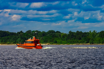Orange pilot boat in action