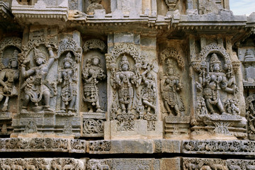 Ornate bas relieif and sculptures of Hindu deities, Kedareshwara Temple, Halebid, Karnataka