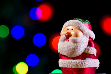 Cute Santa Claus on shiny lighting background