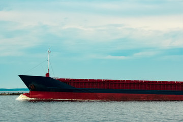 Blue cargo ship underway