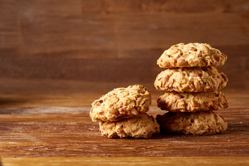 Bunch of chocolate biscuits on a rustic wooden background, close-up, selective focus.
