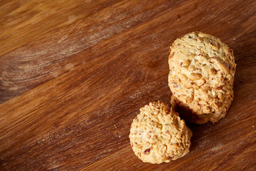 Bunch of chocolate biscuits on a rustic wooden background, close-up, selective focus.