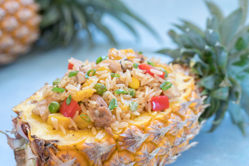 pineapple stuffed with fried rice, chicken and vegetables