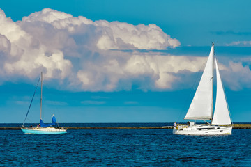 Sailboats traveling by Baltic sea