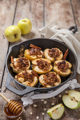 Baked apple with nuts, honey and oat flakes