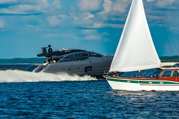 Grey motor yacht in move